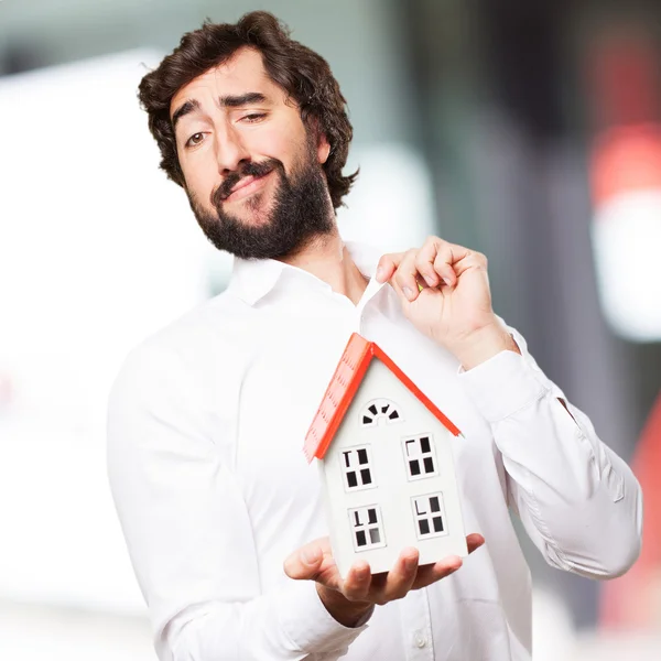 Man holding a house — Stock Photo, Image