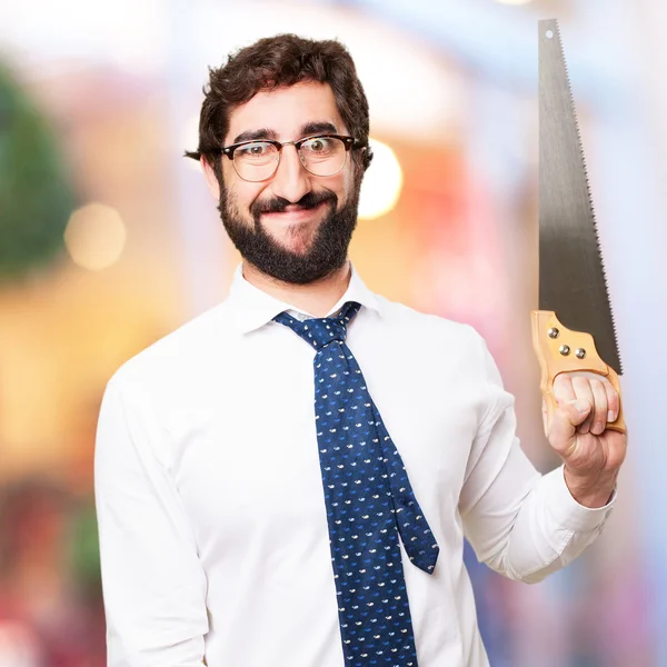 Businessman with a saw — Stock Photo, Image