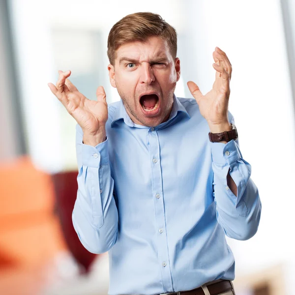 Blonder Mann verrückte Geste — Stockfoto