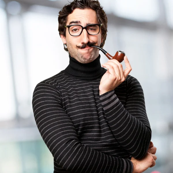 Pedantic man with a pipe — Stock Photo, Image