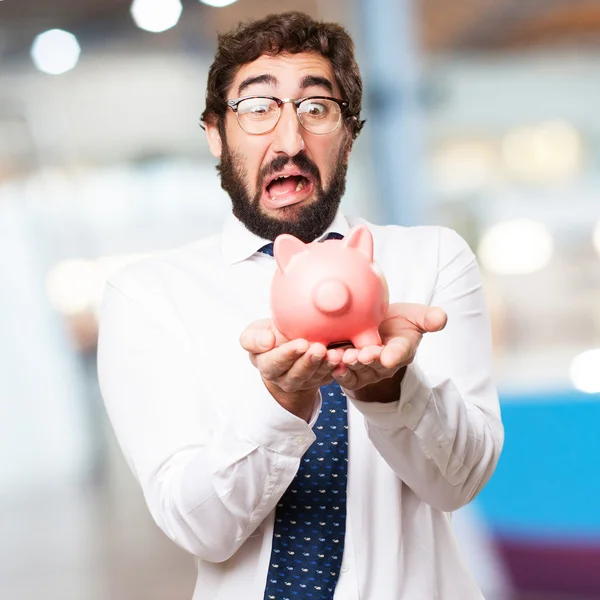 Hombre de negocios con alcancía — Foto de Stock