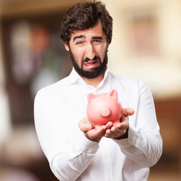 Man met een piggy bank — Stockfoto