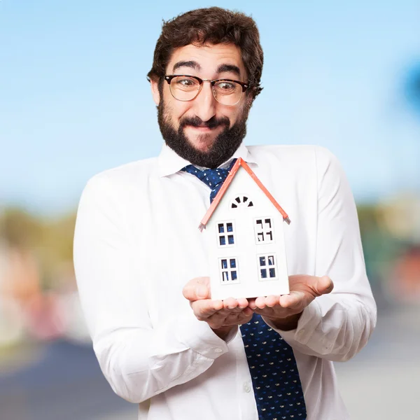 Businessman with a house — Stock Photo, Image