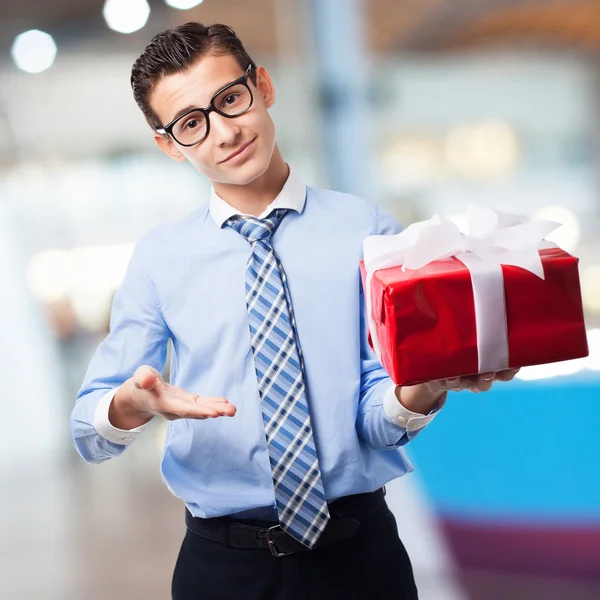 Businessman with a gift — Stock Photo, Image