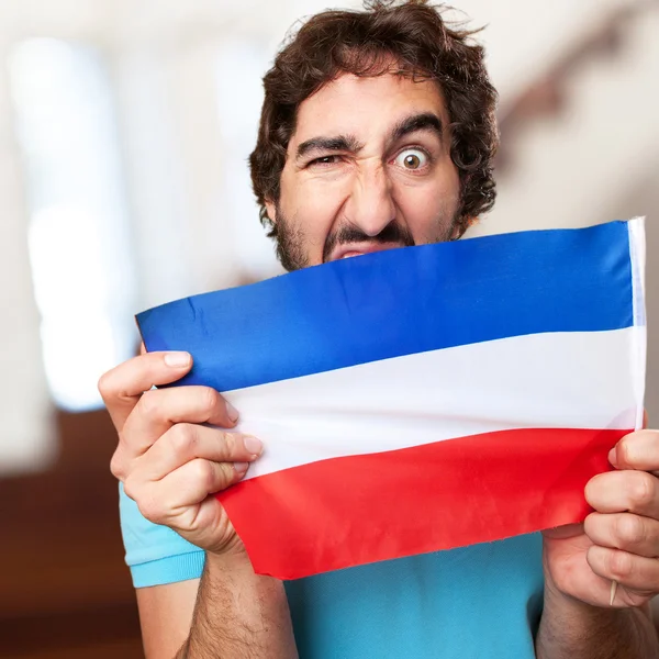 Crazy man with flag — Stock Photo, Image