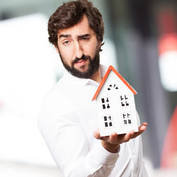 Man holding a house — Stock Photo, Image