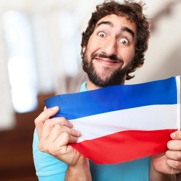 Crazy man with flag — Stock Photo, Image