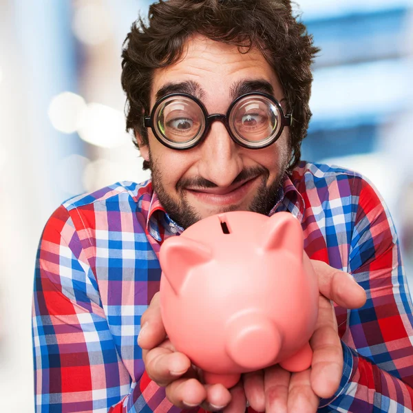 Crazy man with a piggy bank — Stock Photo, Image