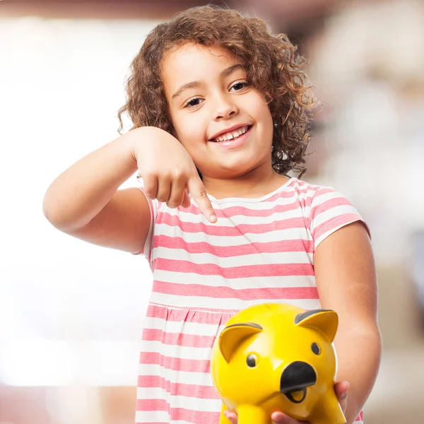 Black girl with a piggy bank — Stock Photo, Image