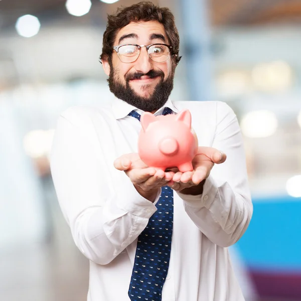 Geschäftsmann mit Sparschwein — Stockfoto