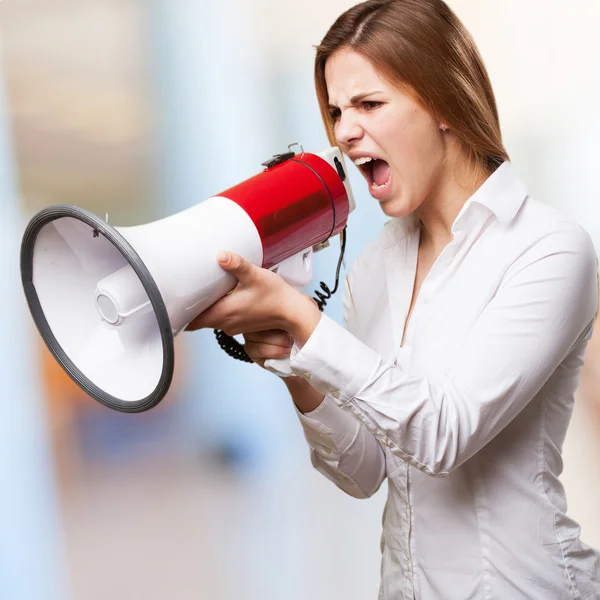 Blond woman with a megaphone — Stock Photo, Image