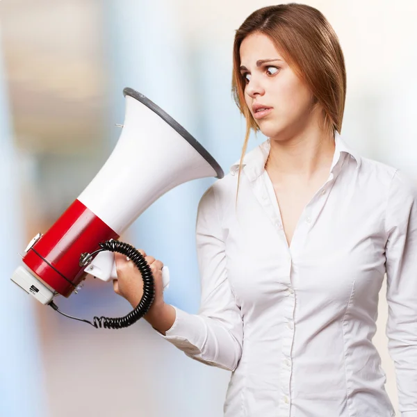 Blond woman with a megaphone — Stock Photo, Image