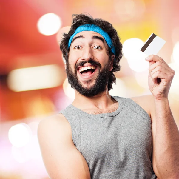 Sportman met credit card — Stockfoto