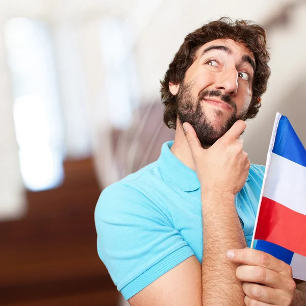 Crazy man with flag — Stock Photo, Image