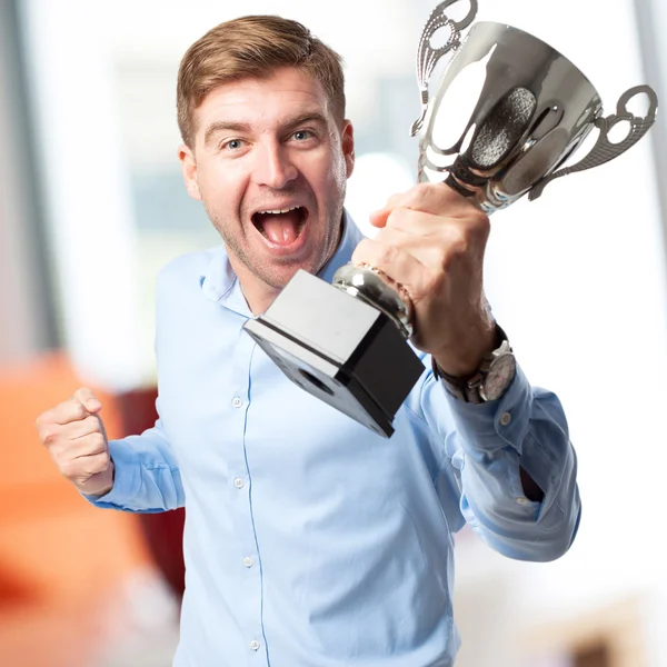 Blond man with a cup Royalty Free Stock Images