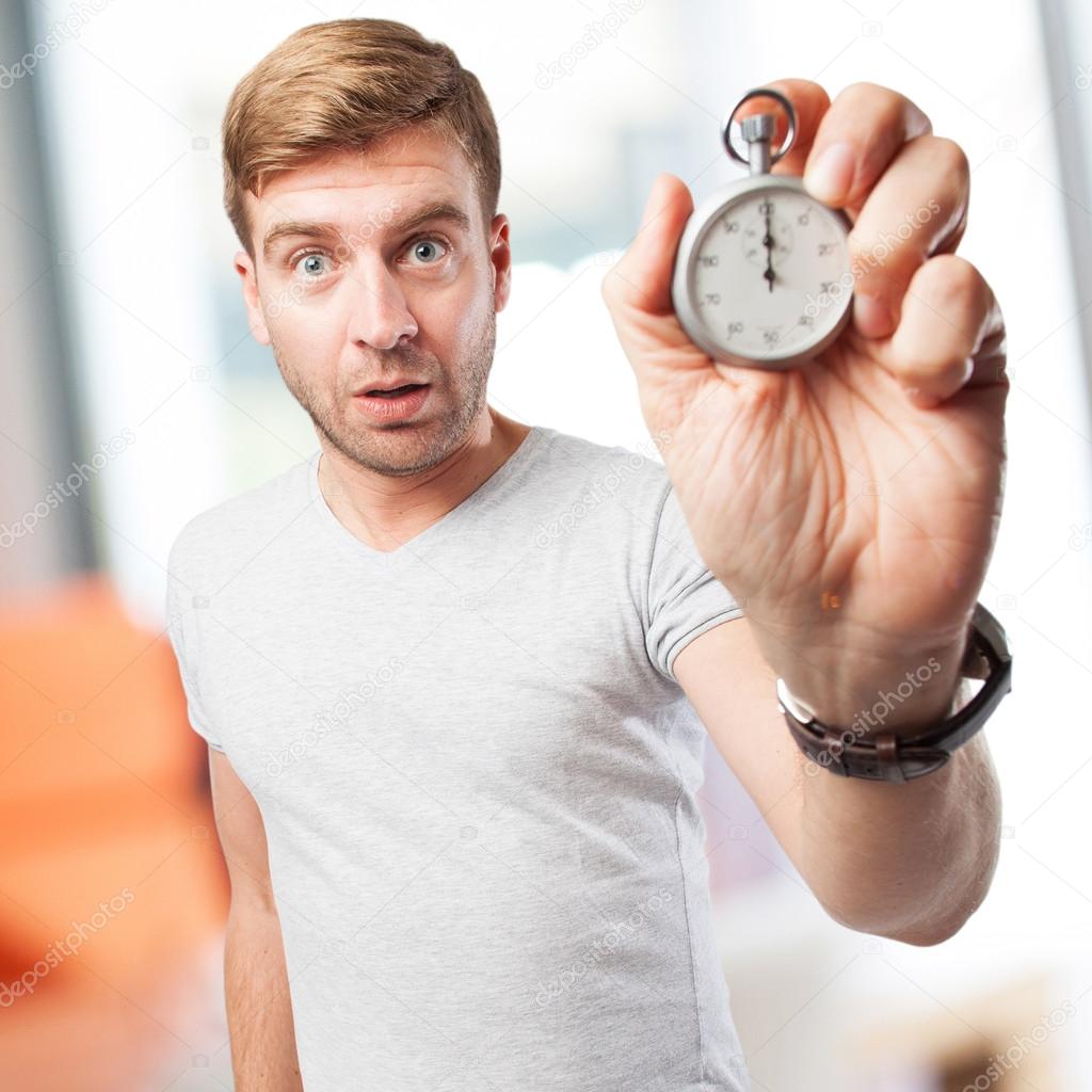 blond man with a stopwatch