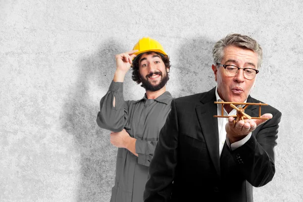 Senior cool man with a wooden plane — Stock Photo, Image