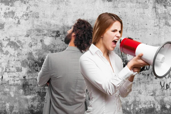 Blonde vrouw met een megafoon — Stockfoto