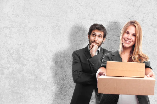 Young cool woman with boxes — Stock Photo, Image