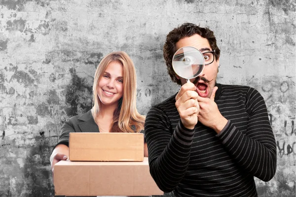 Pedantic man with a magnifier surprised — Stock Photo, Image