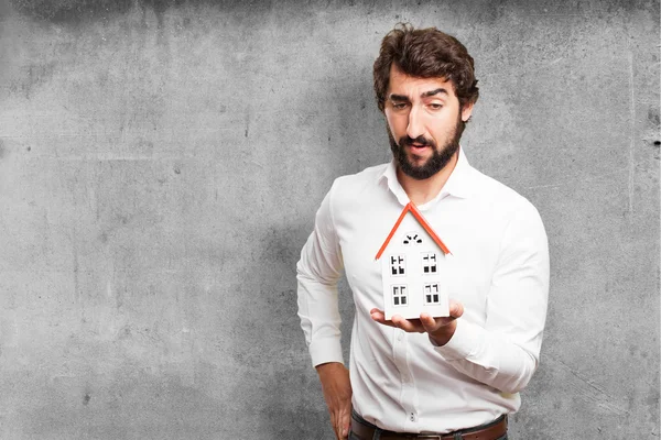 Man holding a house — Stock Photo, Image