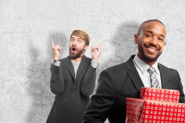 Young cool black man with gift boxes — Stock Photo, Image