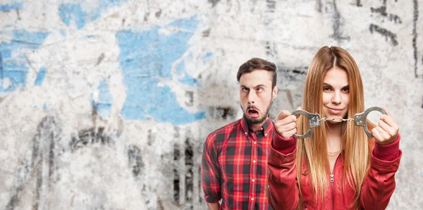 Blond woman with handcuffs — Stock Photo, Image