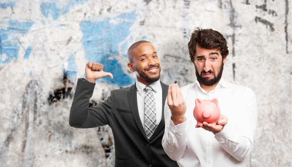 Homem com um banco porquinho — Fotografia de Stock