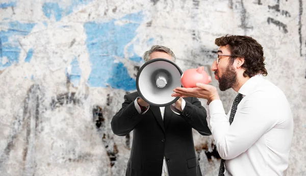 Zakenman met spaarvarken bank — Stockfoto