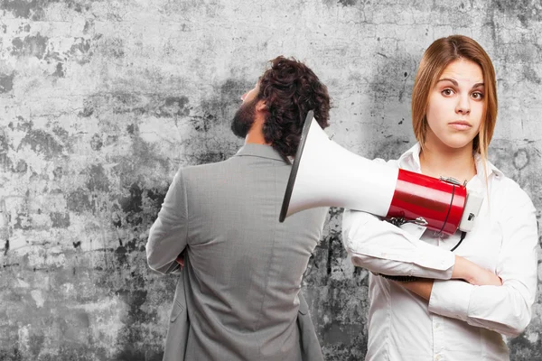 Blonde vrouw met een megafoon — Stockfoto