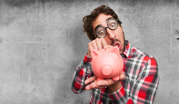 Crazy man met een piggy bank — Stockfoto