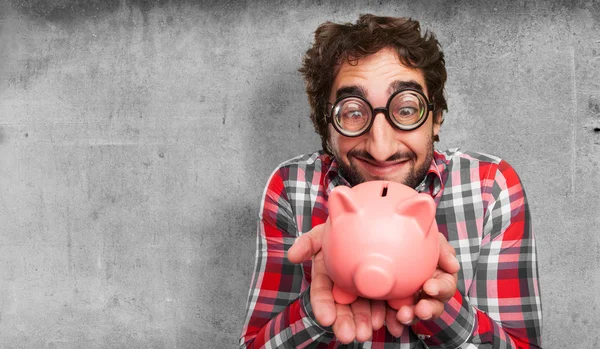 Crazy man with a piggy bank — Stock Photo, Image