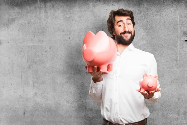 Homem com um banco porquinho — Fotografia de Stock