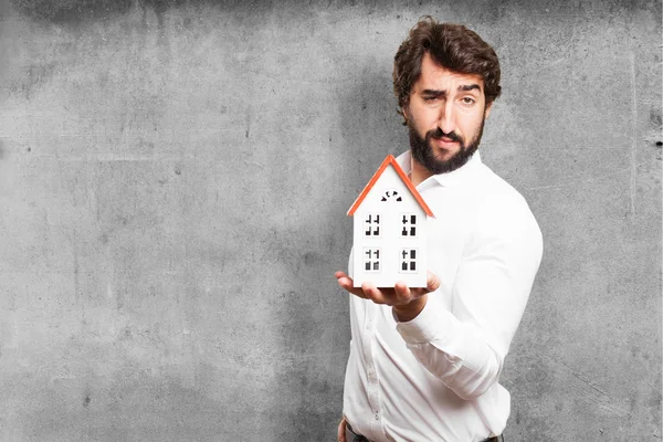 Man holding a house — Stock Photo, Image