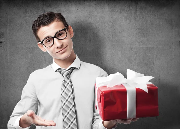 Businessman with a gift — Stock Photo, Image