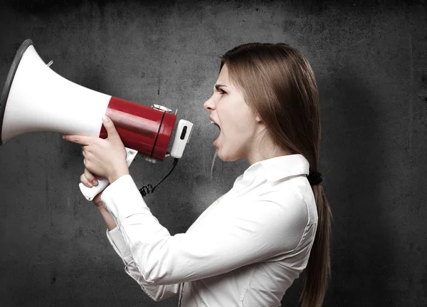 Blond woman with a megaphone — Stock Photo, Image