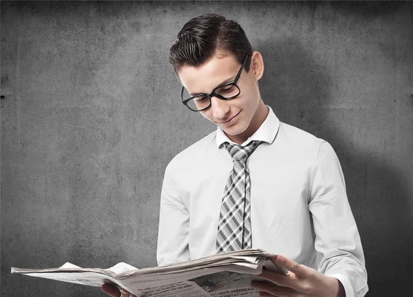 Businessman with newspaper — Stock Photo, Image