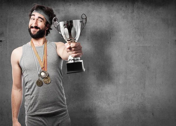 Sportsman with medals and cup — Stock Photo, Image