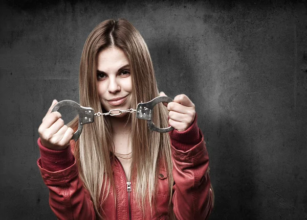 Blond woman with handcuffs — Stock Photo, Image