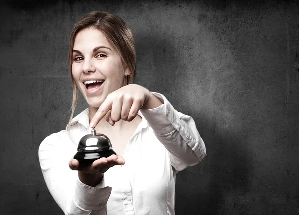 Woman with a call bell — Stock Photo, Image