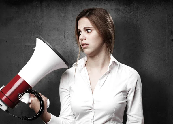 Blond woman with a megaphone — Stock Photo, Image