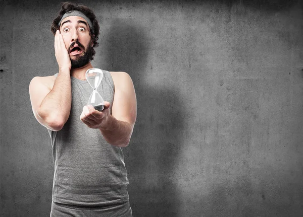 Sportsman with hourglass — Stock Photo, Image