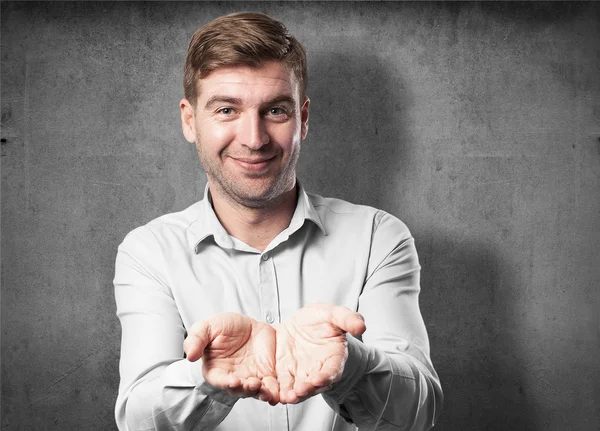 Blond man offering sign — Stock Photo, Image