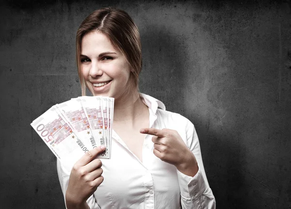 Blond woman with money — Stock Photo, Image