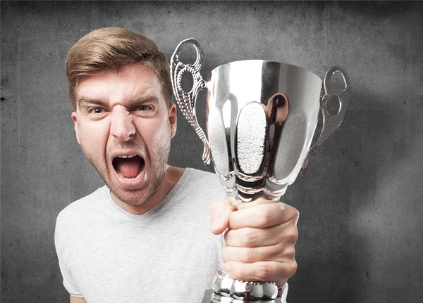 Blond winner man with a cup — Stock Photo, Image