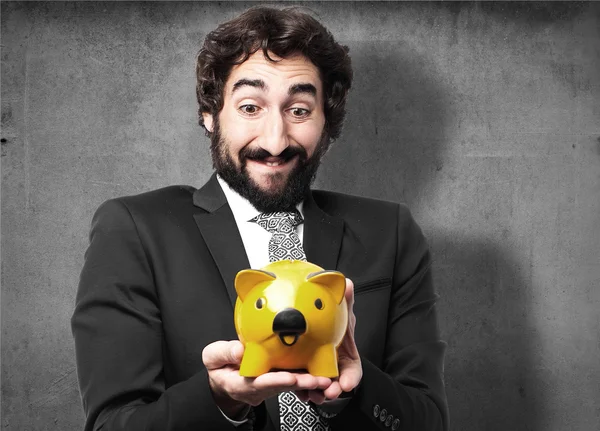 Businessman with a piggy bank — Stock Photo, Image