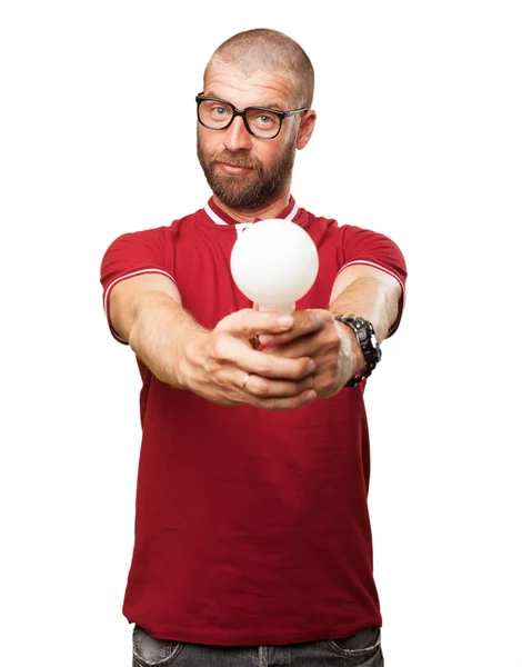 Young man thinking with light bulb — Stock Photo, Image