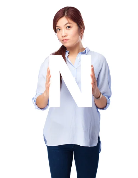 Happy chinese woman with n letter — Stock Photo, Image