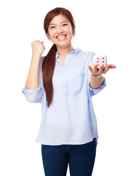 Chinese woman celebrating gesture with dice — Stock Photo, Image