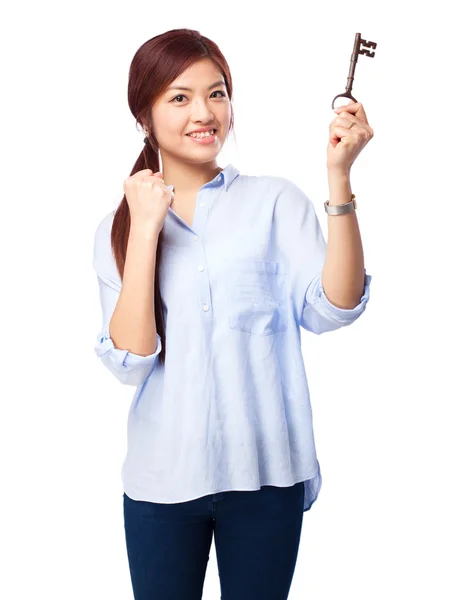 Happy chinese woman with vintage-key — Stock Photo, Image